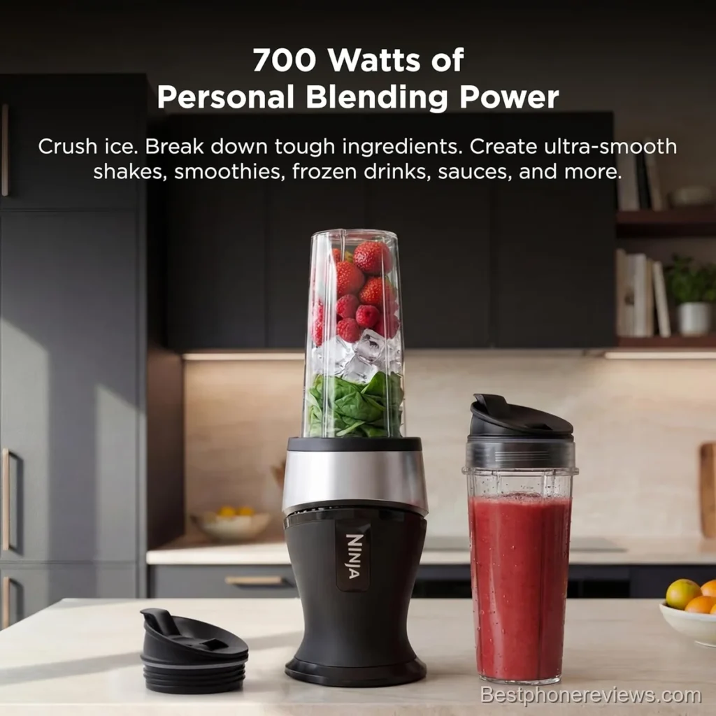 A black Ninja personal blender with a fruit-filled cup.